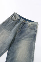 Pantalon en jean vintage délavé à jambes incurvées