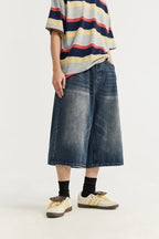 Jean unisexe en denim délavé, coupe courte et jambe large